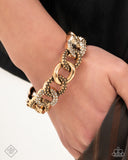 Assertive Austerity - Gold Bracelet Paparazzi
