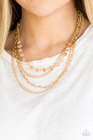 Extravagant Elegance - Gold Necklace Paparazzi